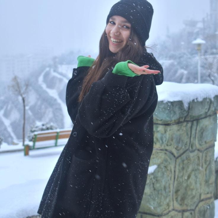 Kaveri Mehta, Lead Design Curator at Studio Haven Parcel, reviewing corporate floral arrangements